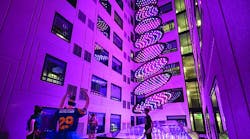 In the millennial-targeted Moxy hotel in San Diego’s Gaslamp Quarter, guestrooms surround a courtyard-like space where an LED-based architainment feature rises from the hotel lobby below through a glass ceiling, delivering dynamic shows conceived to evoke images such as a stream or waterfall. The dynamic RGB-LED-based system was created by Moment Factory and crafted by Digital Ambiance to be a “hero centerpiece fixture” to be enjoyed by guests. (Photo credit: J Street Hospitality.)